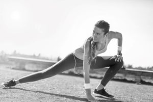 Young woman preparing to run